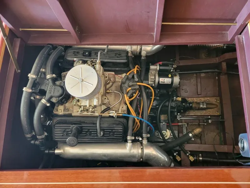 Slide: The Image of 1951 Chris-Craft Riviera 16 engine compartment with visible components and wiring. - 10