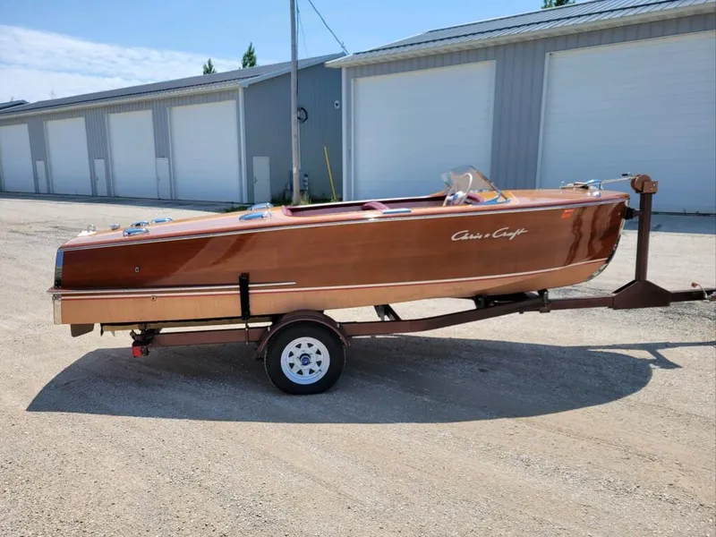 Slide: The Image of 1951 Chris-Craft Riviera 16 classic wooden boat on a trailer. - 11