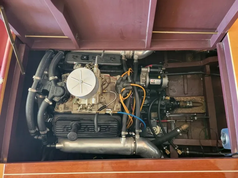 Slide: The Image of 1951 Chris-Craft Riviera 16 engine compartment with visible components and wiring. - 14