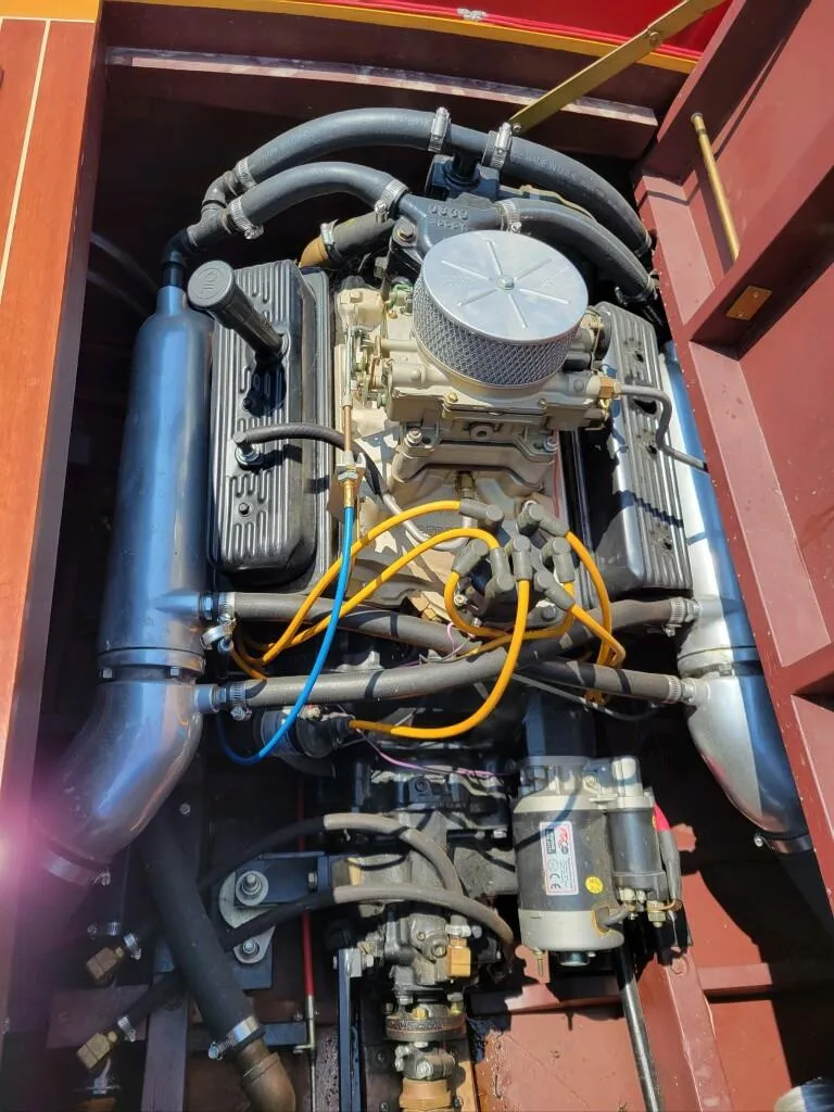 Slide: The Image of 1951 Chris-Craft Riviera 16 engine compartment with detailed view of the engine components. - 9