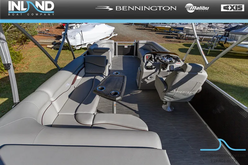 Slide: The Image of 2023 Bennington 22 SL pontoon boat interior with luxurious seating and modern helm. - 10