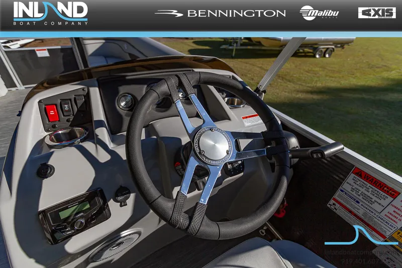 Slide: The Image of 2023 Bennington 22 SL boat steering console with modern controls and sleek design. - 12