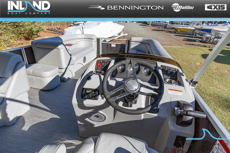 Slide: The Image of 2023 Bennington 22 SL boat interior with steering console and seating. - 13