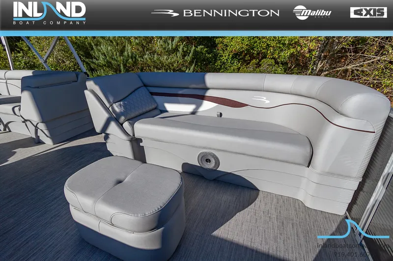Slide: The Image of 2023 Bennington 22 SL boat interior with gray seating and ottoman. - 17