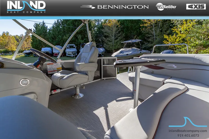 Slide: The Image of 2023 Bennington 22 SL pontoon boat interior with luxurious seating and modern helm. - 20