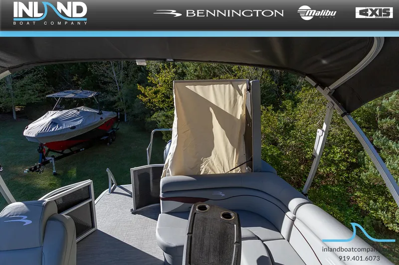 Slide: The Image of 2023 Bennington 22 SL pontoon boat interior with seating and canopy. - 21