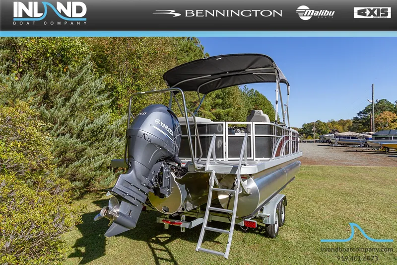 Slide: The Image of 2023 Bennington 22 SL pontoon boat with Yamaha outboard motor on trailer. - 4
