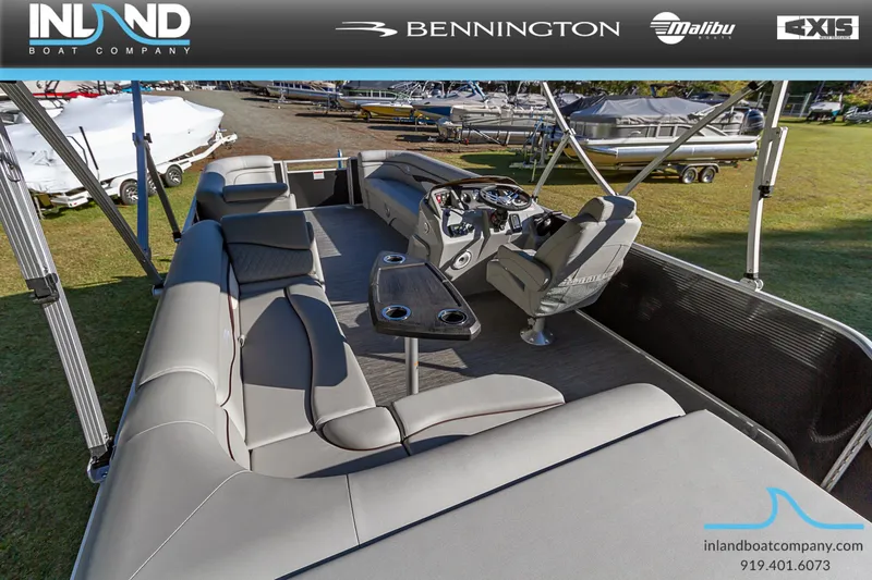 Slide: The Image of 2023 Bennington 22 SL pontoon boat interior with spacious seating and modern helm. - 9