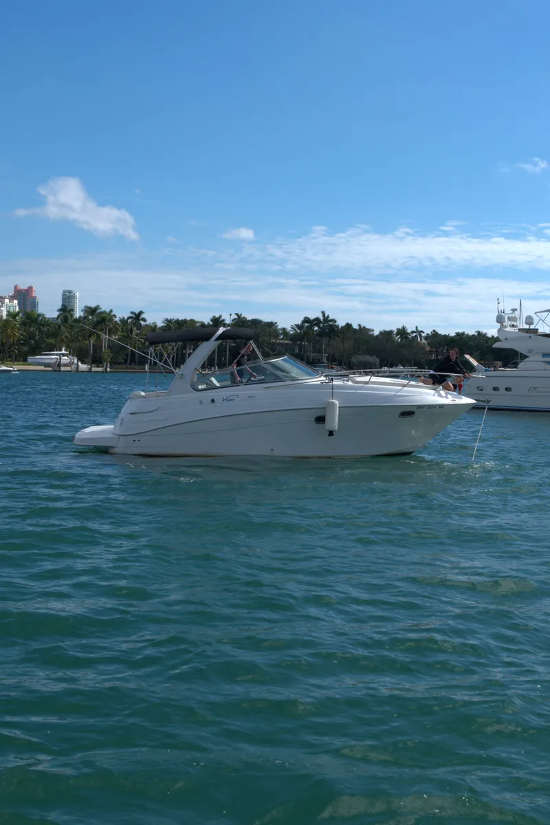 Slide: The Image of 2004 Four Winns Vista boat anchored on a sunny day. - 4