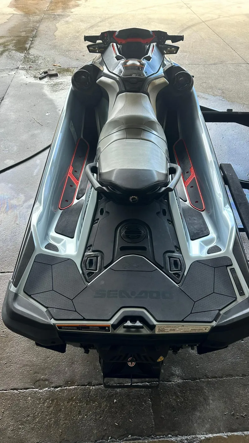 Slide: The Image of 2018 Sea-Doo RXT-X 300 jet ski on a trailer, top view. - 2