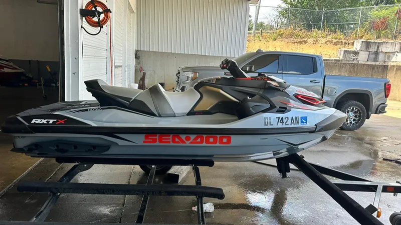 Slide: The Image of 2018 Sea-Doo RXT-X 300 jet ski on a trailer in a garage. - 4
