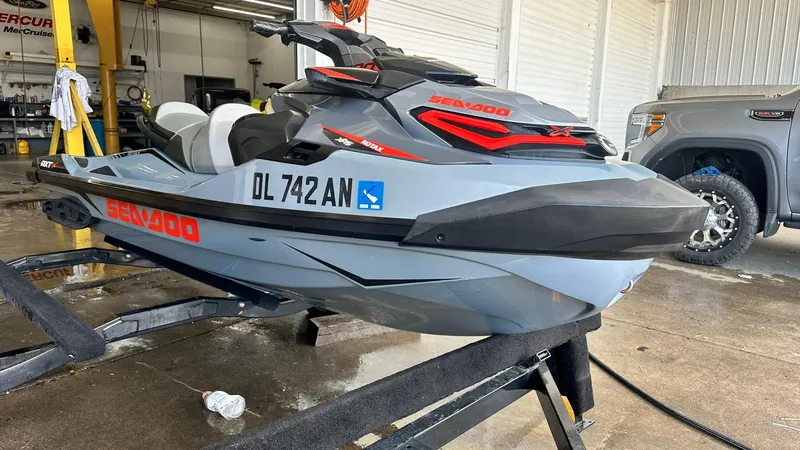 Slide: The Image of 2018 Sea-Doo RXT-X 300 jet ski on a trailer in a garage. - 5