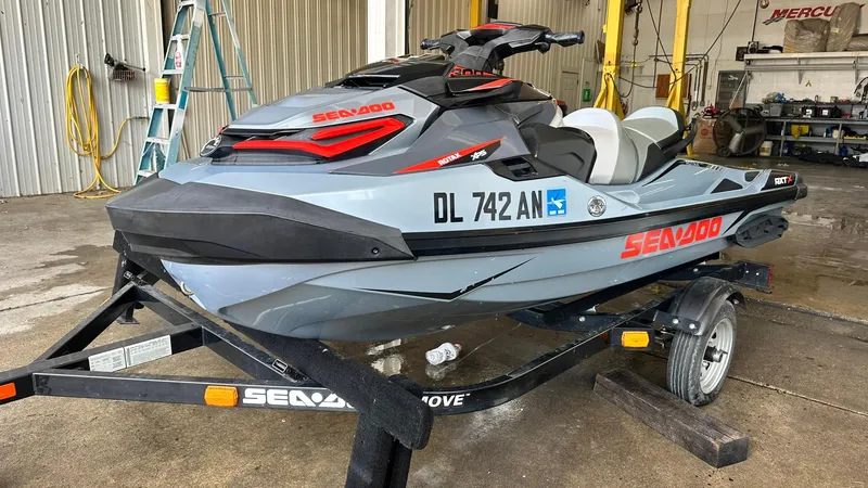 Slide: The Image of 2018 Sea-Doo RXT-X 300 jet ski on trailer in a garage. - 6