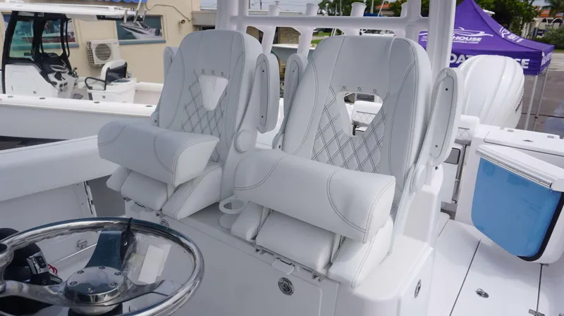 Slide: The Image of Luxury seating on the 2025 Sportsman 302 OPEN boat, featuring white leather upholstery. - 11