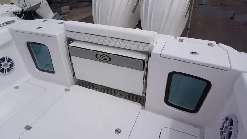 Slide: The Image of 2025 Sportsman 302 OPEN boat interior with seating and storage compartments. - 15