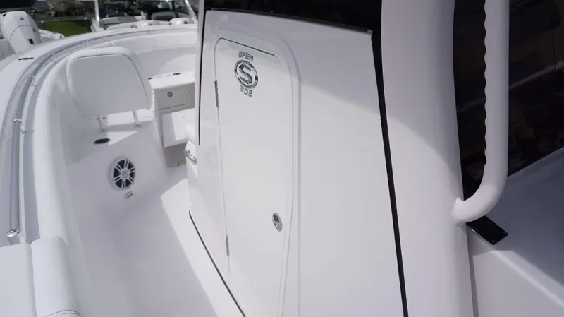 Slide: The Image of 2025 Sportsman 302 OPEN boat interior, featuring sleek white design and modern amenities. - 24