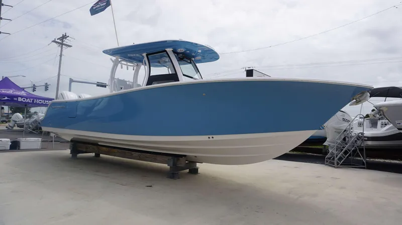 Slide: The Image of 2025 Sportsman 302 OPEN boat on display at a dealership. - 3