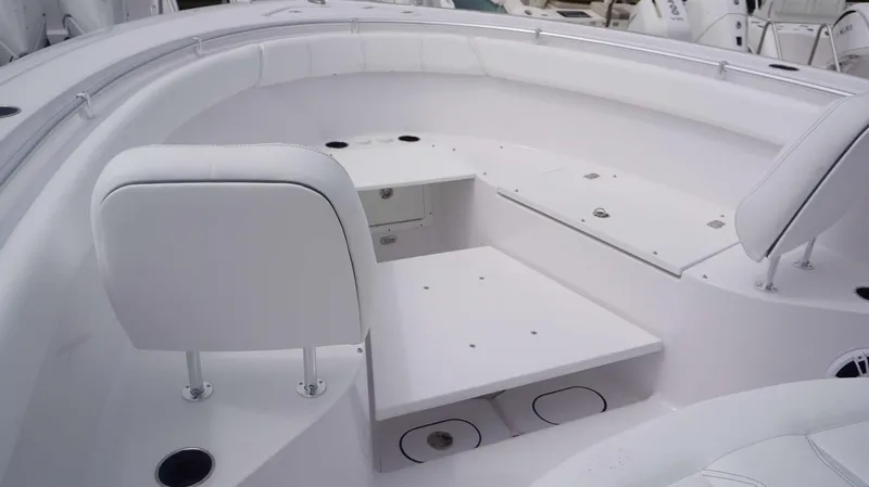 Slide: The Image of Interior of 2025 Sportsman 302 OPEN boat with white seating and storage compartments. - 5
