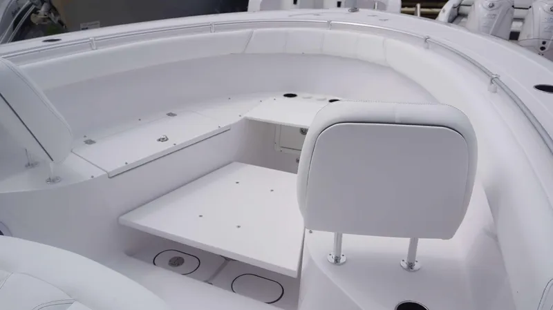 Slide: The Image of Interior of 2025 Sportsman 302 OPEN boat with white seating and storage compartments. - 6
