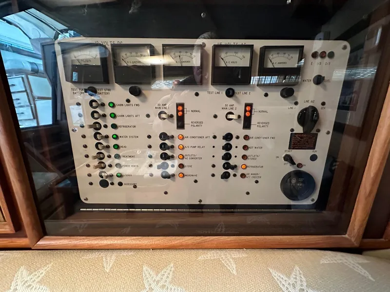 Slide: The Image of Control panel of a 1986 Sea Ray 390 Express Cruiser boat. - 16