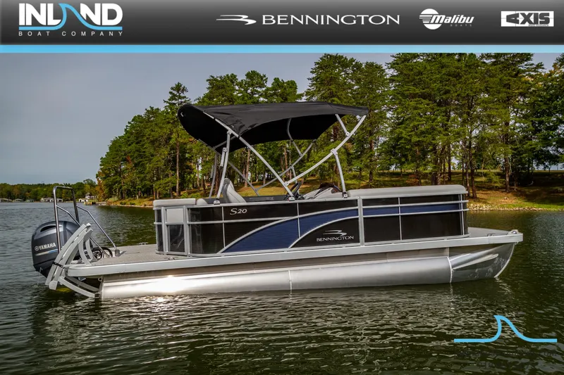 The Image of 2023 Bennington 20 SLM pontoon boat on a lake with a forested background. - 0