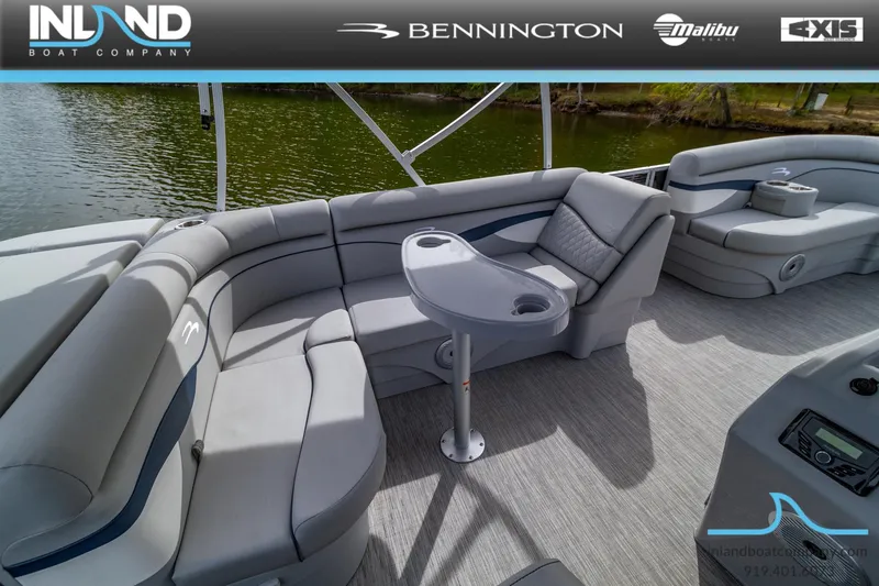 Slide: The Image of 2023 Bennington 20 SLM pontoon boat interior with gray seating and table. - 10