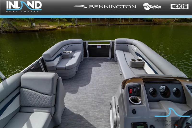 Slide: The Image of 2023 Bennington 20 SLM pontoon boat with spacious seating and modern dashboard. - 11