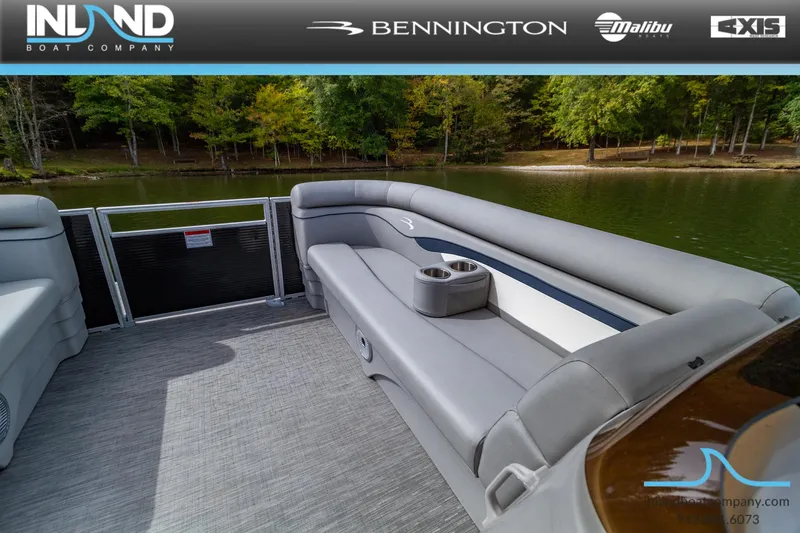 Slide: The Image of 2023 Bennington 20 SLM pontoon boat interior with gray seating and cup holders. - 12