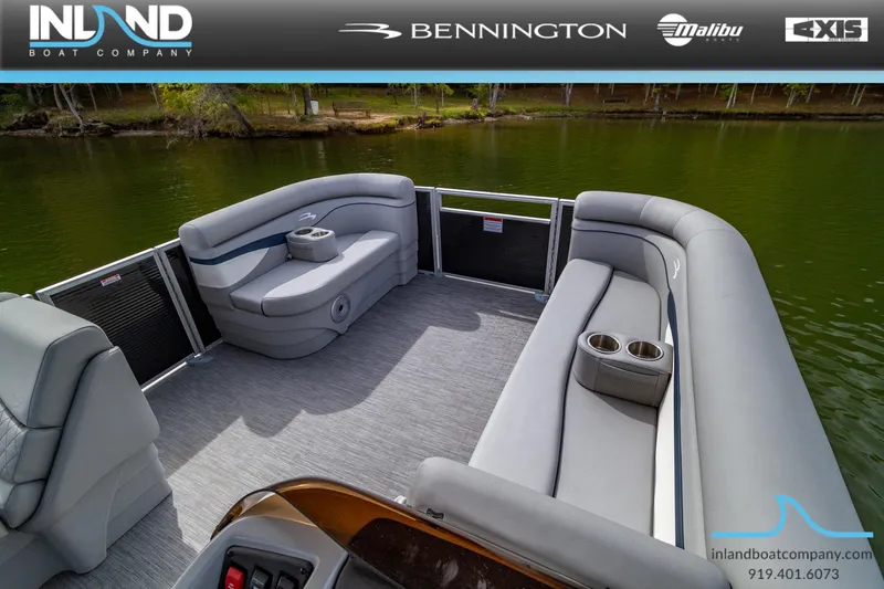 Slide: The Image of 2023 Bennington 20 SLM pontoon boat interior with plush seating and cup holders. - 13
