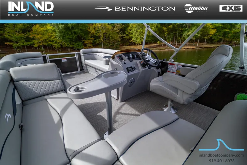 Slide: The Image of 2023 Bennington 20 SLM pontoon boat interior with luxurious seating and modern dashboard. - 14