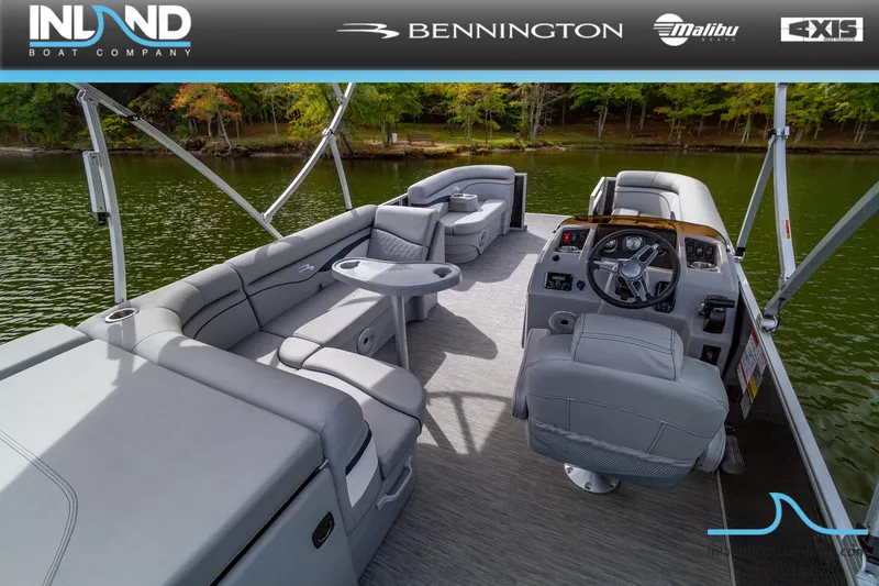 Slide: The Image of 2023 Bennington 20 SLM pontoon boat interior with gray seating and steering console. - 6