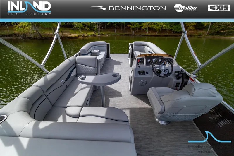 Slide: The Image of 2023 Bennington 20 SLM pontoon boat with luxurious seating and modern helm. - 7