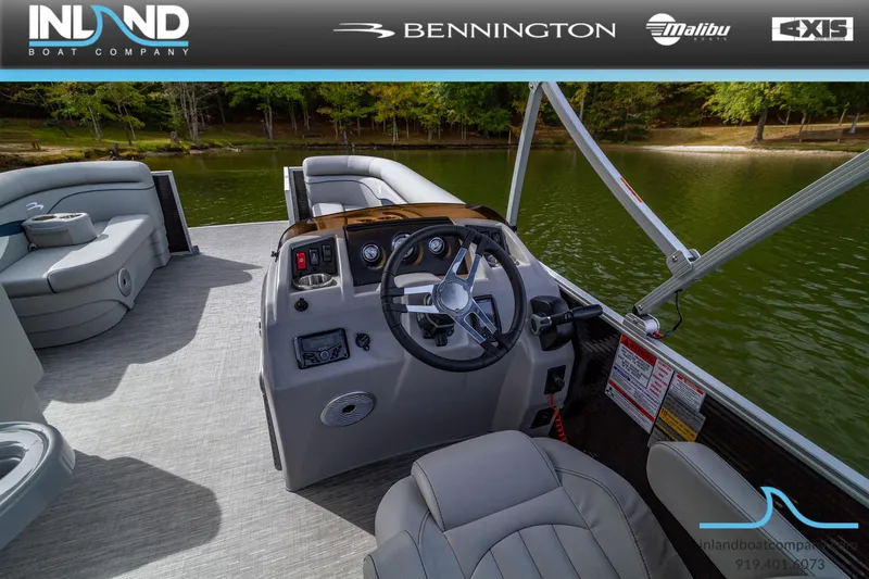 Slide: The Image of 2023 Bennington 20 SLM pontoon boat interior with steering console and seating. - 8