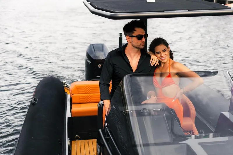 Slide: The Image of Couple enjoying a ride on a 2024 Onda Magna boat. - 10