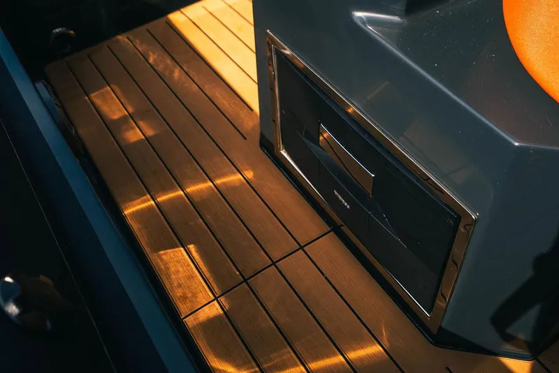 Slide: The Image of 2024 Onda Magna boat interior with wooden flooring and modern design. - 16