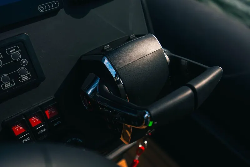 Slide: The Image of Close-up of 2024 Onda Magna boat throttle control and dashboard. - 11