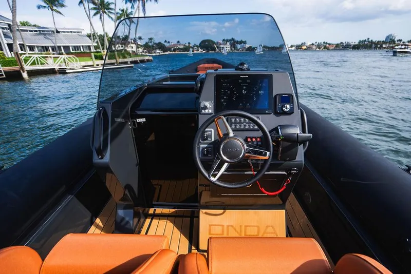 Slide: The Image of 2024 Onda Magna boat cockpit with modern steering wheel and navigation system. - 19
