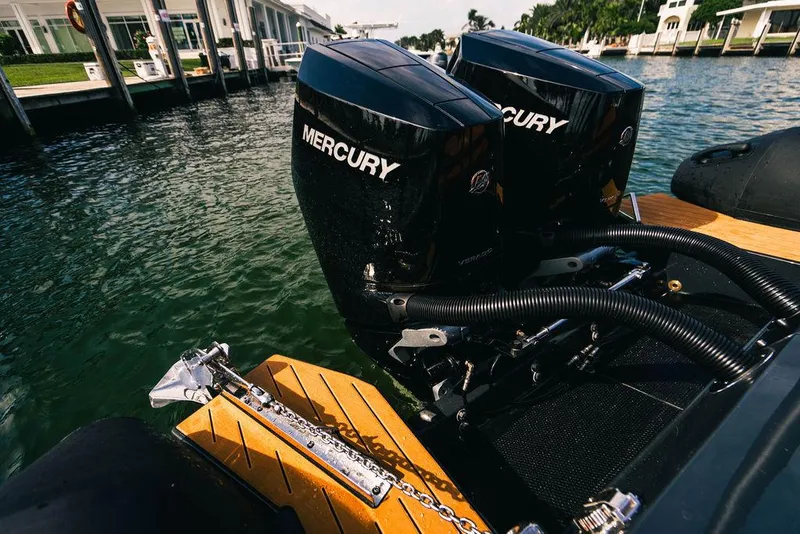 Slide: The Image of 2024 Onda Magna boat with dual Mercury outboard engines docked at marina. - 28