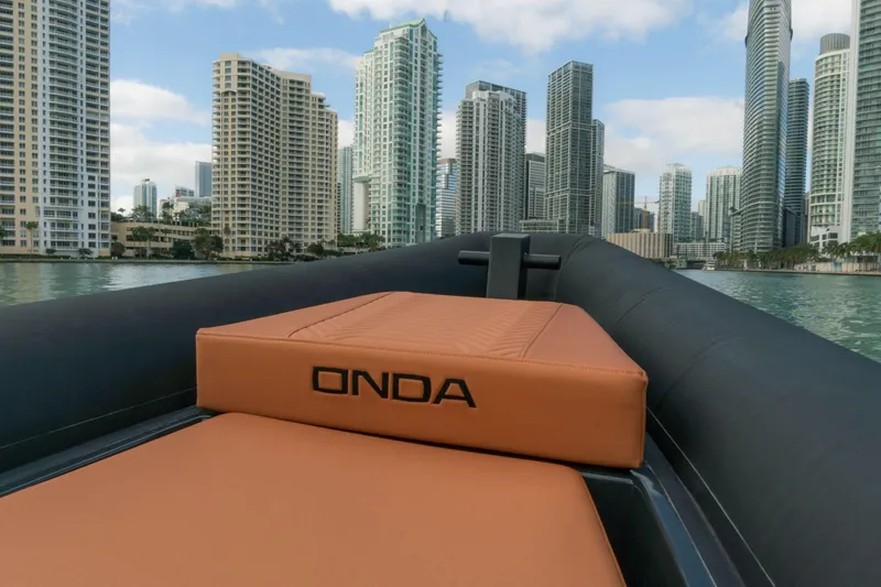 Slide: The Image of 2024 Onda Magna boat cruising near city skyscrapers. - 3