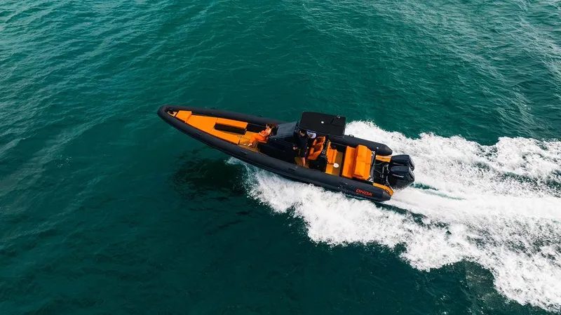 Slide: The Image of 2024 Onda Magna boat cruising on open water. - 9