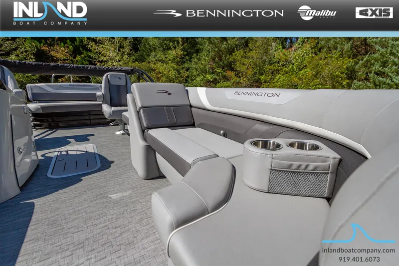 Slide: The Image of 2023 Bennington 22 SXSB boat interior with gray seating and cup holders. - 11