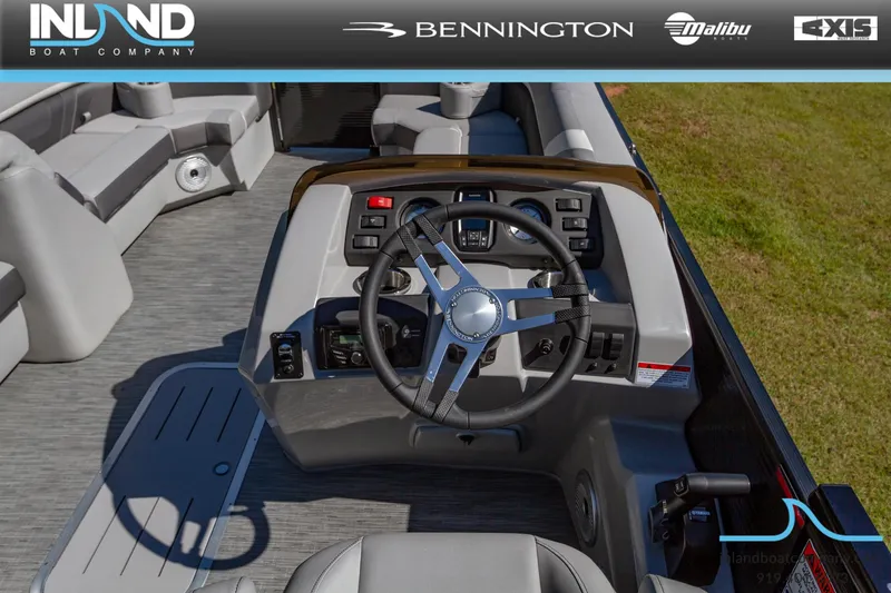 Slide: The Image of 2023 Bennington 22 SXSB boat dashboard and steering wheel, showcased by Inland Boat Company. - 13