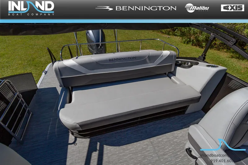 Slide: The Image of 2023 Bennington 22 SXSB boat interior with gray seating and deck. - 16