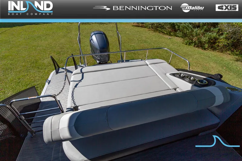 Slide: The Image of 2023 Bennington 22 SXSB boat with spacious seating and powerful outboard motor. - 19