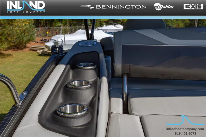 Slide: The Image of 2023 Bennington 22 SXSB boat interior with cup holders and seating, by Inland Boat Company. - 21