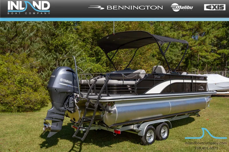 Slide: The Image of 2023 Bennington 22 SXSB pontoon boat on a trailer with Yamaha outboard motor. - 3