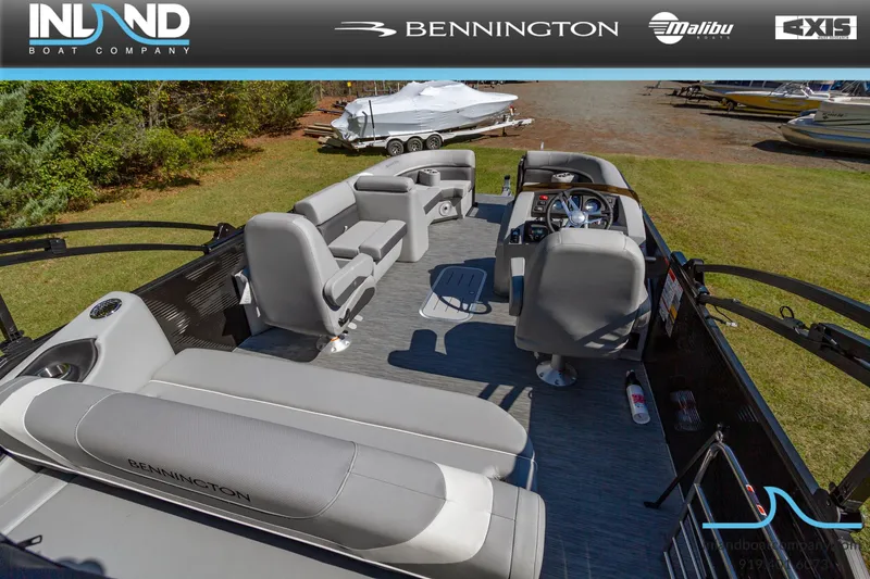 Slide: The Image of 2023 Bennington 22 SXSB pontoon boat interior with gray seating and steering console. - 6