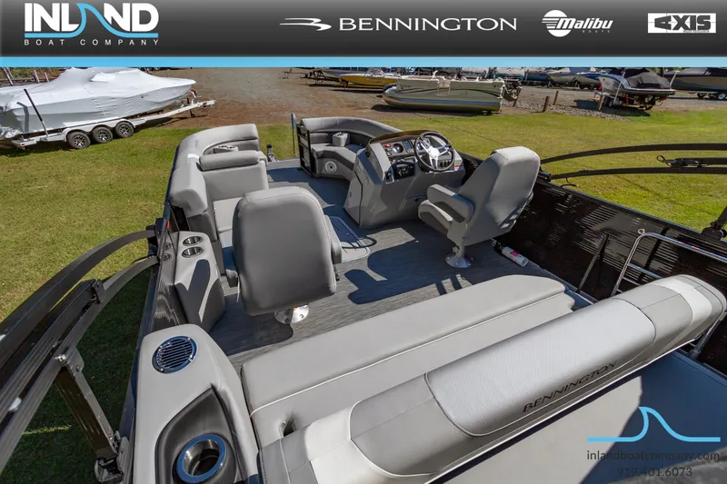 Slide: The Image of 2023 Bennington 22 SXSB pontoon boat interior with gray seating and steering console. - 7