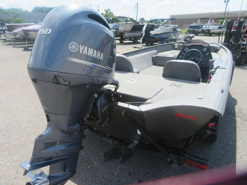 Slide: The Image of 2019 War Eagle 2170 boat with Yamaha 150 outboard motor in a parking lot. - 2