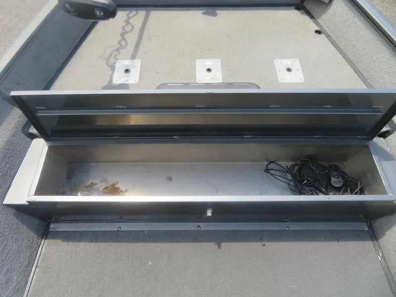 Slide: The Image of Open storage compartment in 2019 War Eagle 2170 boat, showing interior space and wiring. - 3